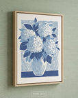Blue hydrangea flowers arranged in a vase, rendered in a graphic botanical print style with layered blue tones.