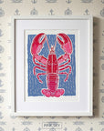 Red lobster wall art print on blue background, coastal nautical artwork for kitchen or beach house decor
